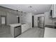 Open kitchen featuring stainless steel appliances, white cabinets, and quartz countertops at 119 Ridgecrest Dr, Eustis, FL 32726