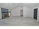 Bright living space with light wood floors, brick fireplace, and entry door at 119 Ridgecrest Dr, Eustis, FL 32726