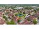 Wonderful aerial view of condo community with beautiful landscaping and central pond at 12107 Poppy Field Ln # 105, Orlando, FL 32837