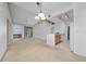 Bright and airy living room with neutral tones, access to the kitchen, and dining area at 12107 Poppy Field Ln # 105, Orlando, FL 32837