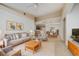 Bright and airy living room with neutral tones, dining space, and views of the kitchen at 12107 Poppy Field Ln # 105, Orlando, FL 32837
