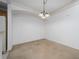 Neutral and blank canvas living room that features an open area for dining at 12107 Poppy Field Ln # 105, Orlando, FL 32837
