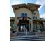 Upscale community building entrance with stone accents and a decorated entryway at 1325 Rotonda Pt # 117, Lake Mary, FL 32746