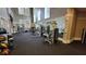 Community fitness center featuring free weights and weight machines with mirrored wall at 1325 Rotonda Pt # 117, Lake Mary, FL 32746