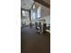 Community fitness center featuring modern equipment, high ceilings, and large windows at 1325 Rotonda Pt # 117, Lake Mary, FL 32746
