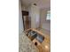 Granite counters and stainless steel sink and refrigerator highlight this kitchen space at 1325 Rotonda Pt # 117, Lake Mary, FL 32746