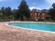 An inviting outdoor pool surrounded by lounge chairs and seating under gazebo, perfect for relaxing by the water at 1325 Rotonda Pt # 117, Lake Mary, FL 32746
