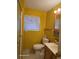 This is a bright bathroom with a window, vanity, and toilet at 138 Maple Dr, Debary, FL 32713