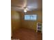 Cozy bedroom featuring wood-look flooring, ceiling fan, and natural light from the window at 138 Maple Dr, Debary, FL 32713