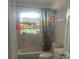 A compact bathroom with a shower-tub combination, a toilet, and basic vanity at 1414 Park Manor Dr, Orlando, FL 32825