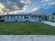 Charming single-story home featuring a covered carport and well-maintained front lawn at 1414 Park Manor Dr, Orlando, FL 32825