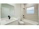 Modern bathroom featuring a bathtub with shower, a white vanity with modern fixtures, and a clean design at 14957 Sw 63Rd Court Rd, Ocala, FL 34473