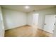 Bright bedroom featuring wood floors, neutral paint, and closet at 14957 Sw 63Rd Court Rd, Ocala, FL 34473