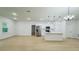 Bright open-concept living room and kitchen area features recessed lighting and modern fixtures at 14957 Sw 63Rd Court Rd, Ocala, FL 34473