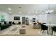 Open-concept living space featuring modern kitchen with stainless steel appliances and stylish dining area at 14957 Sw 63Rd Court Rd, Ocala, FL 34473