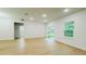 Bright living room featuring wood floors, slider to the yard, and neutral paint at 14957 Sw 63Rd Court Rd, Ocala, FL 34473