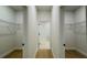 Spacious walk-in closet features ample storage with wire shelving on both sides and wood flooring at 14957 Sw 63Rd Court Rd, Ocala, FL 34473
