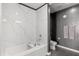 Elegant bathroom showcasing a bathtub, textured walls, and modern fixtures at 150 E Robinson St # 2812, Orlando, FL 32801