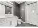 Updated bathroom features a floating sink, toilet, and marble tile glass shower at 150 E Robinson St # 2812, Orlando, FL 32801