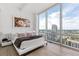 Luxurious bedroom with expansive windows and cityscape views at 150 E Robinson St # 2812, Orlando, FL 32801