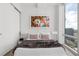 Stylish bedroom with modern art and floor-to-ceiling windows at 150 E Robinson St # 2812, Orlando, FL 32801