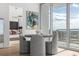 Dining area with large windows showcasing beautiful city views, adjacent to bedroom at 150 E Robinson St # 2812, Orlando, FL 32801
