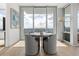 Dining area with floor-to-ceiling windows offering stunning city views at 150 E Robinson St # 2812, Orlando, FL 32801