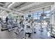Spacious gym area with various cardio machines and large windows overlooking the city at 150 E Robinson St # 2812, Orlando, FL 32801