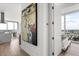Bright hallway leads to a bedroom and open concept living area with expansive city views at 150 E Robinson St # 2812, Orlando, FL 32801
