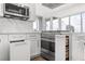 Kitchen featuring stainless steel appliances, sleek white cabinets, and modern pull out features at 150 E Robinson St # 2812, Orlando, FL 32801