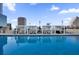 Rooftop pool with shaded lounge chairs and city views at 150 E Robinson St # 2812, Orlando, FL 32801