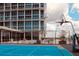 Community basketball court on rooftop with seating and city views at 150 E Robinson St # 3408, Orlando, FL 32801