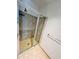 Walk-in shower features glass doors and tile surround in renovated bathroom at 150 E Robinson St # 3408, Orlando, FL 32801