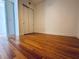 A bedroom featuring wood floors and a closet with sliding doors at 150 E Robinson St # 3408, Orlando, FL 32801