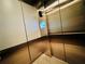 Elevator interior with stainless steel finishes and electronic display screen at 150 E Robinson St # 3408, Orlando, FL 32801