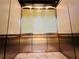 Elevator interior with glass panels and stainless steel finishes at 150 E Robinson St # 3408, Orlando, FL 32801