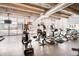 Brightly lit gym with modern equipment and floor-to-ceiling windows showcasing city views at 150 E Robinson St # 3408, Orlando, FL 32801