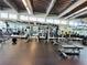 Well-equipped gym featuring cardio machines, weights, and mirrored walls for a complete workout experience at 150 E Robinson St # 3408, Orlando, FL 32801