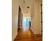 Bright hallway featuring wood floors and opening to living area with floor to ceiling windows showcasing stunning city views at 150 E Robinson St # 3408, Orlando, FL 32801