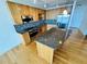 Open kitchen featuring an island with granite countertops and stainless steel appliances at 150 E Robinson St # 3408, Orlando, FL 32801
