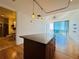 Open kitchen with island featuring granite countertops and views to other rooms at 150 E Robinson St # 3408, Orlando, FL 32801
