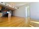 Open floor plan featuring kitchen and living room with hardwood floors at 150 E Robinson St # 3408, Orlando, FL 32801