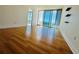 Spacious living room with floor-to-ceiling windows and hardwood floors at 150 E Robinson St # 3408, Orlando, FL 32801
