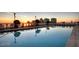 A serene rooftop pool reflects the sunrise and surrounding cityscape at 150 E Robinson St # 3408, Orlando, FL 32801