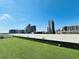 Rooftop green space with views of city skyscrapers at 150 E Robinson St # 3408, Orlando, FL 32801