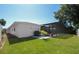 Lush backyard featuring a well-maintained lawn and an enclosed pool area at 1529 Glastonberry Rd, Maitland, FL 32751