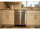 Stainless steel dishwasher surrounded by white cabinets and granite countertops at 1529 Glastonberry Rd, Maitland, FL 32751