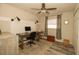 Well-lit home office setup with a desk, computer, chair, and storage space at 1529 Glastonberry Rd, Maitland, FL 32751