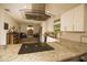 Modern kitchen features stainless steel appliances, a range hood, and granite countertops at 1529 Glastonberry Rd, Maitland, FL 32751