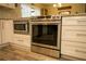 Modern kitchen showcasing a stainless steel range, built-in microwave, and white cabinetry at 1529 Glastonberry Rd, Maitland, FL 32751
